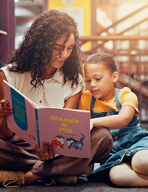 Teacher reading with student