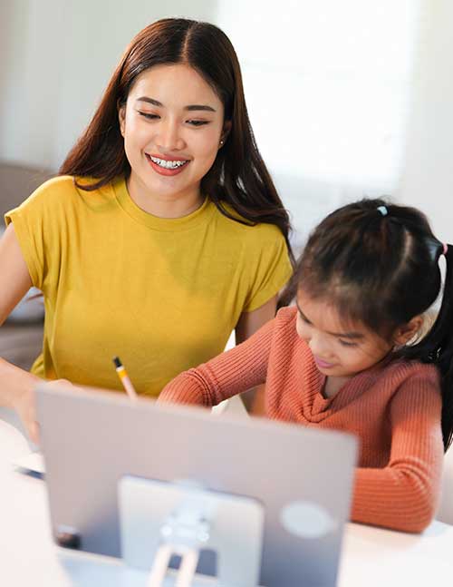 Teacher working with student