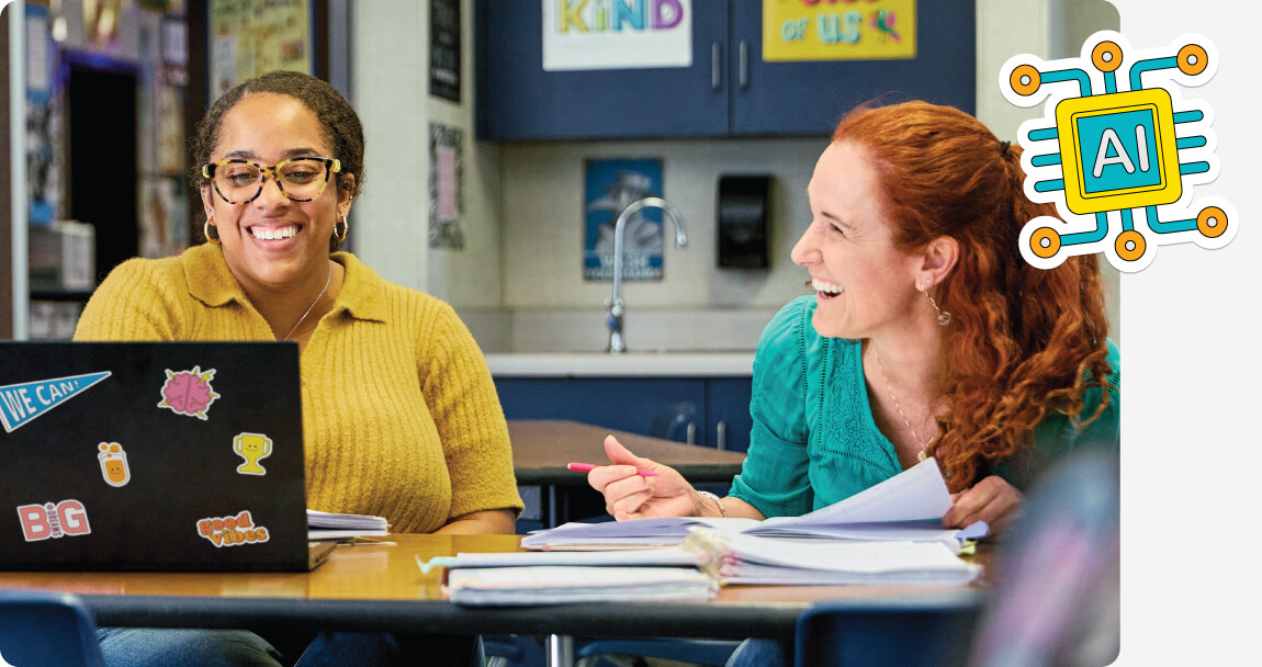 Group of teachers using a laptop