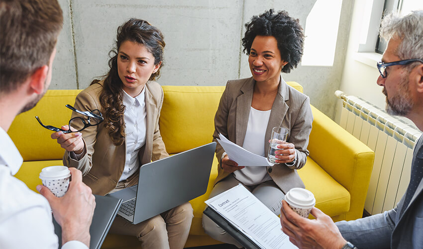a group of teachers in a collaborating