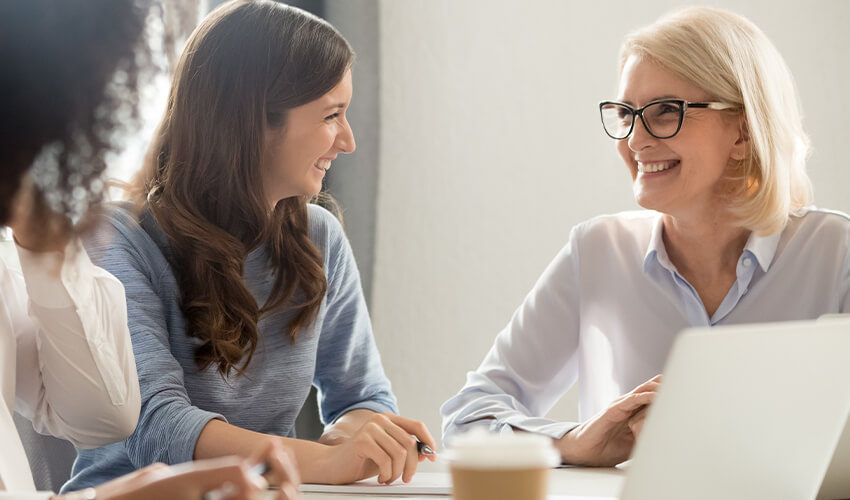 a group of teachers in a collaborating