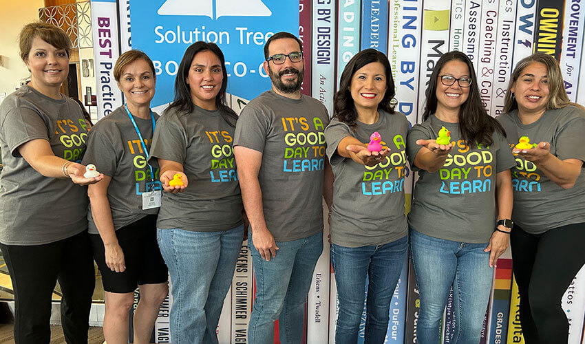 Group of Grassland Elementary School educators posing together at a PLC Event