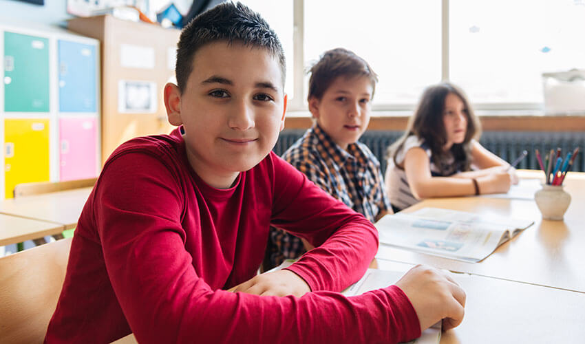 Elementary students working at their desks